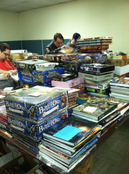One of three tables holding the games prior to auction. Click for humongous version.
