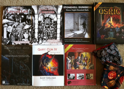 Some of the treasures I brought home from Gary Con IV. Check out those beautiful dice bags. Click for bigger version.