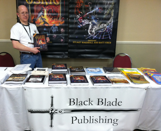 Jon Hershberger of Black Blade sells me a copy of OSRIC