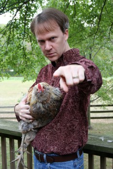 attack-rooster Howard Andrew Jones with his Review Rooster.