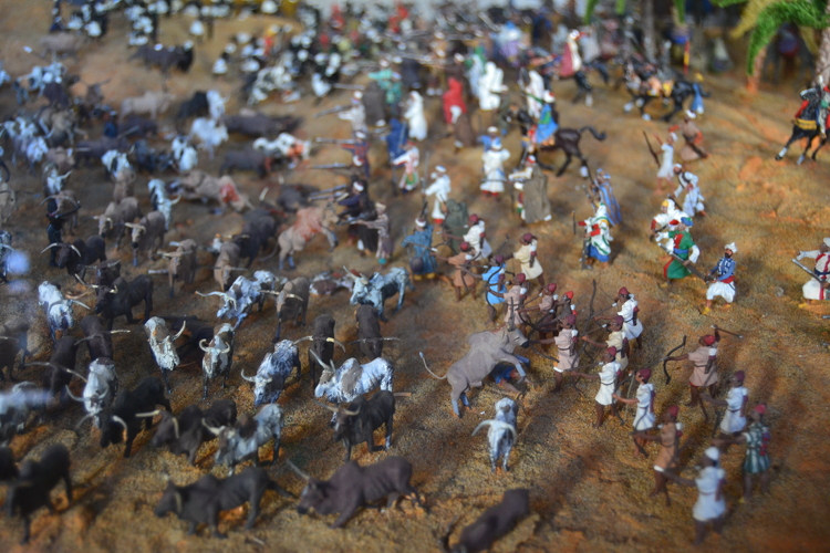 Songhai warriors hiding behind the herd of cattle