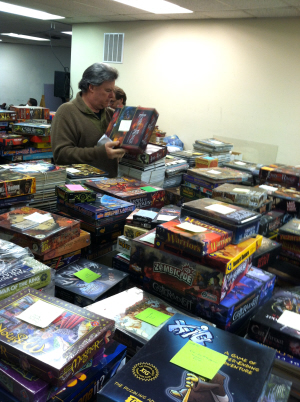 Just one of the mountains of games waiting to go to auction. Click for bigger version.