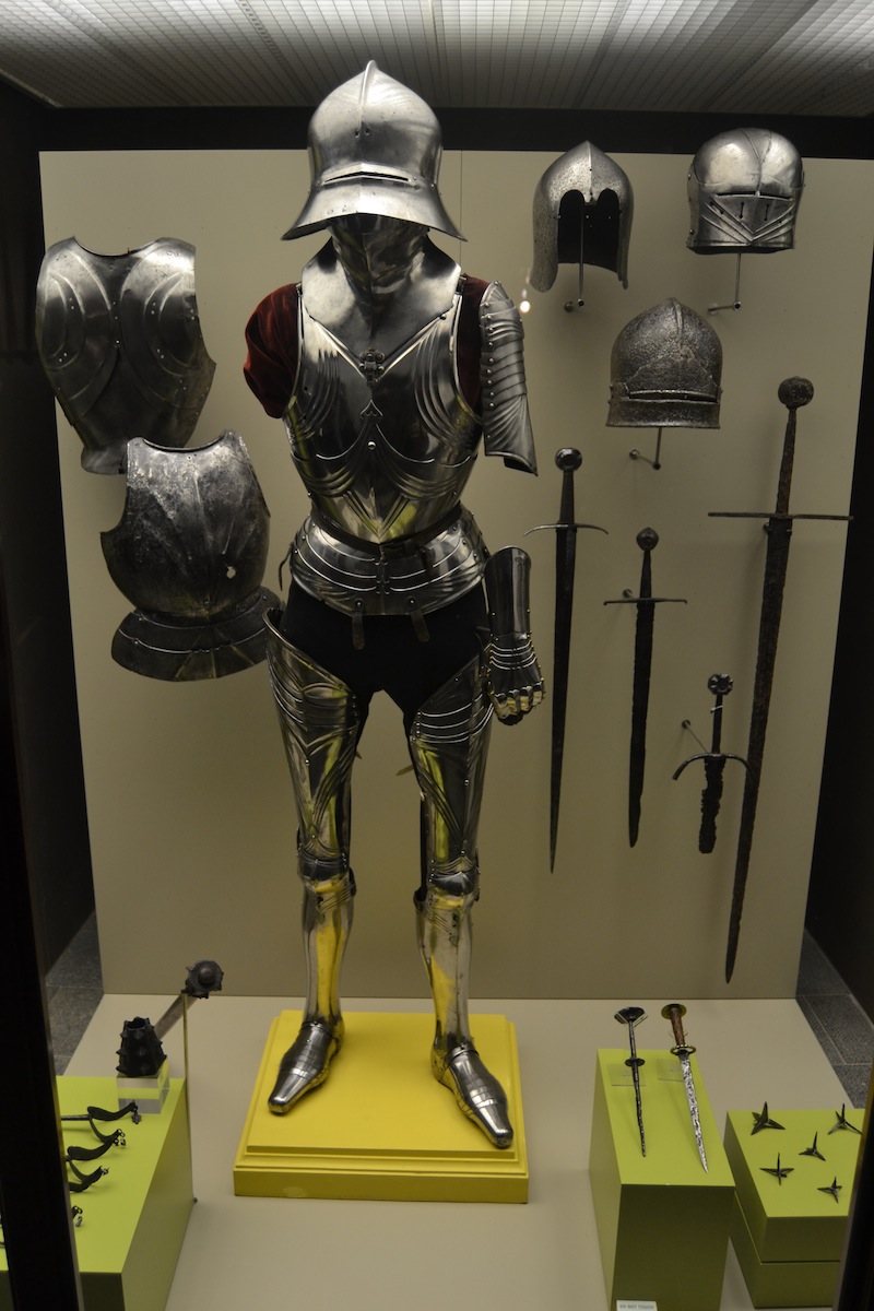 This suit of Gothic armor is made up of elements from several suits, a common practice in many armories throughout Europe. All the pieces are mid-15th century German. On the lower right are two rondel daggers (Netherlands, 15th century) and some caltrops (late 15th century).