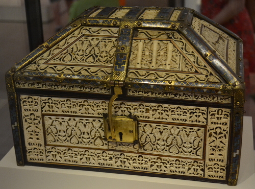 Casket from the Cathedral of Palencia. The intricate ivory work shows whorled leaves and palmettes, birds, animals, and hunting scenes. An Arabic inscription in Kufic-style calligraphy says it was made in 441 after Hijra (1049-1050 AD) in a workshop in Cuenca, Spain, by 'Abd al-Rahman ben Zayyan for the prince of Toledo.