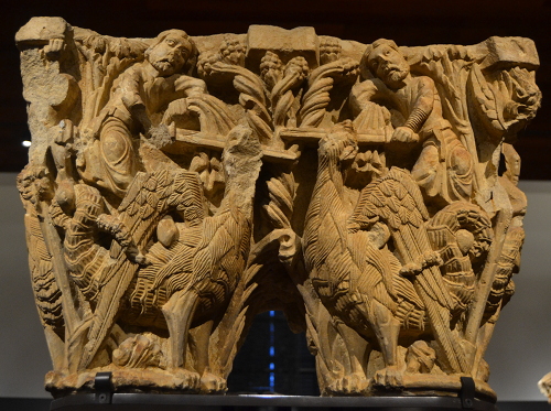 Undated double column capital showing human figures and basilisks.