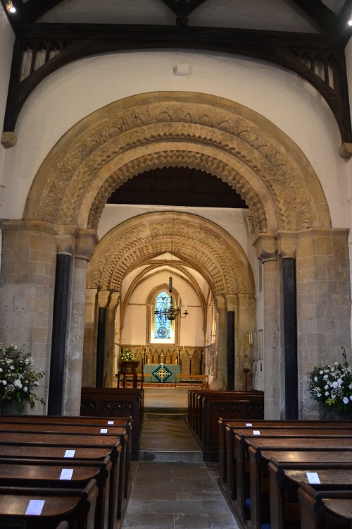 The interior, showing an original arch and the black marble pillars from Flanders.