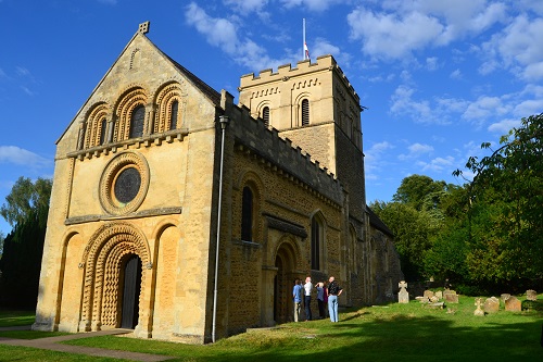 Iffley Church from the southwest, showing hte main west entrance. The yew is to the right.