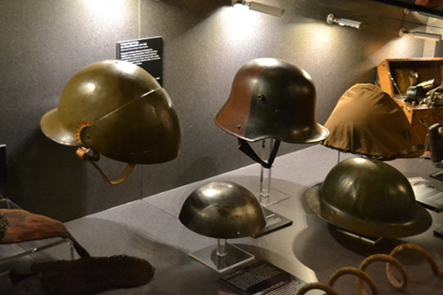 Various models of steel helmets. The little cap in the center is a French model, privately bought by a cautious soldier. Photo copyright Sean McLachlan.