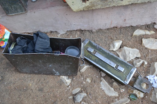This battered old munitions box makes a handy place to store shoe shine and rags.