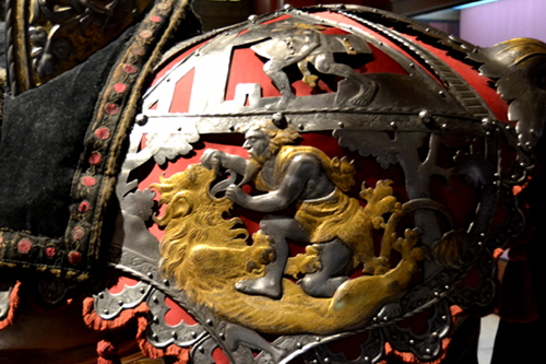 A set of barding made for Charles V decorated with the Labors of Hercules. Here Hercules defeats the Nemean Lion.