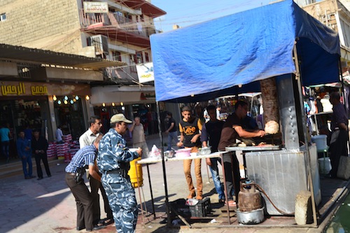 The only street shot I got of Mosul, a quick snap out the window of our van as one of our guards ran out to grab some food before whisking us away. Virtually no women were on the streets.