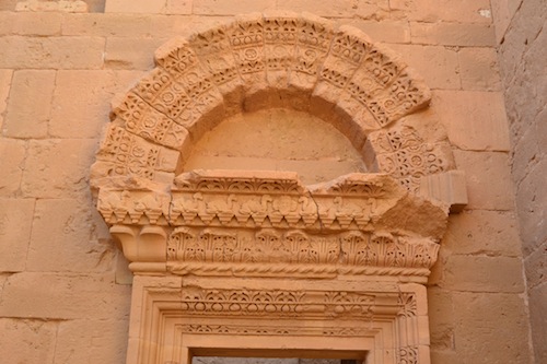 A typical Hatran archway. Note the camels and rosettes.