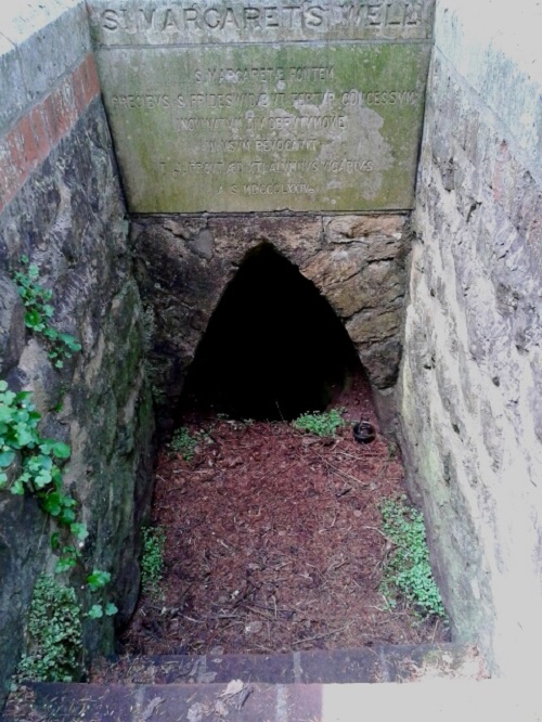 Steps down to the holy well.