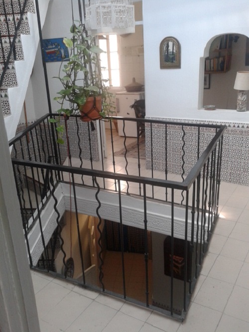 My main floor, with a bedroom and kitchen downstairs and a rooftop terrace upstairs.