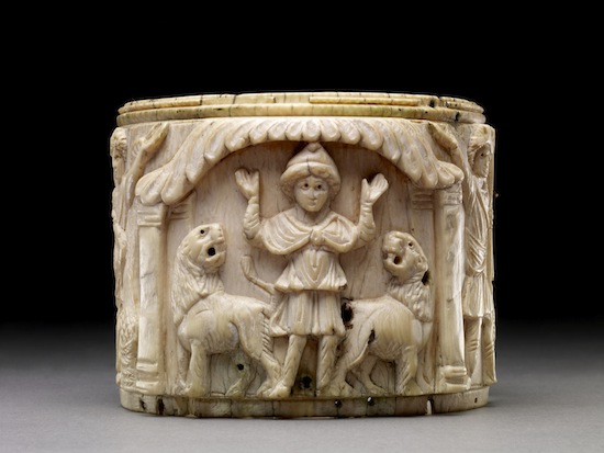 Ivory pyxis box depicting Daniel with arms raised in prayer flanked by two lions, Egypt or Syria, 5th or early 6th century AD © The Trustees of the British Museum