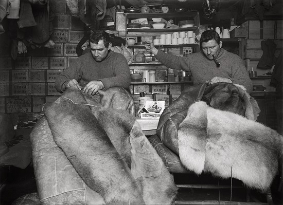 Herbert George Ponting - Petty officer Evans and Crean mending sleeping bags