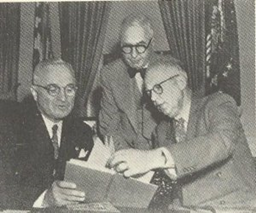 Truman receiving a copy of "The Blue Carbuncle from Elmer Davis & Edgar W. Smith.