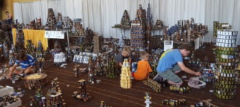 Cardhalla at GenCon is a fundraiser. Over the four day event, donated cards are used to build elaborate towers and other structures. On Sunday, convention goers hurl coins at the structures to topple them ... and the collected funds are donated,