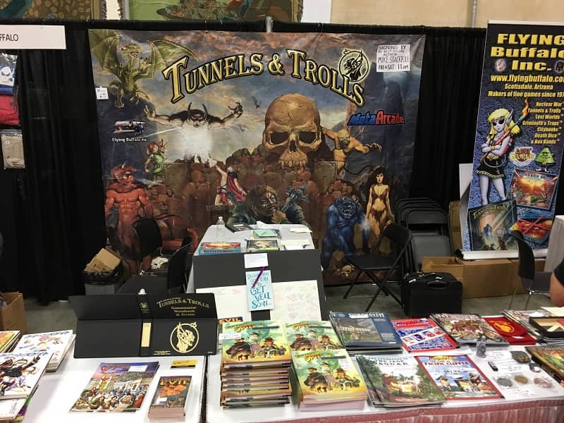 Flying Buffalo booth at Gen Con 2019, with Rick Loomis Get Well board-small